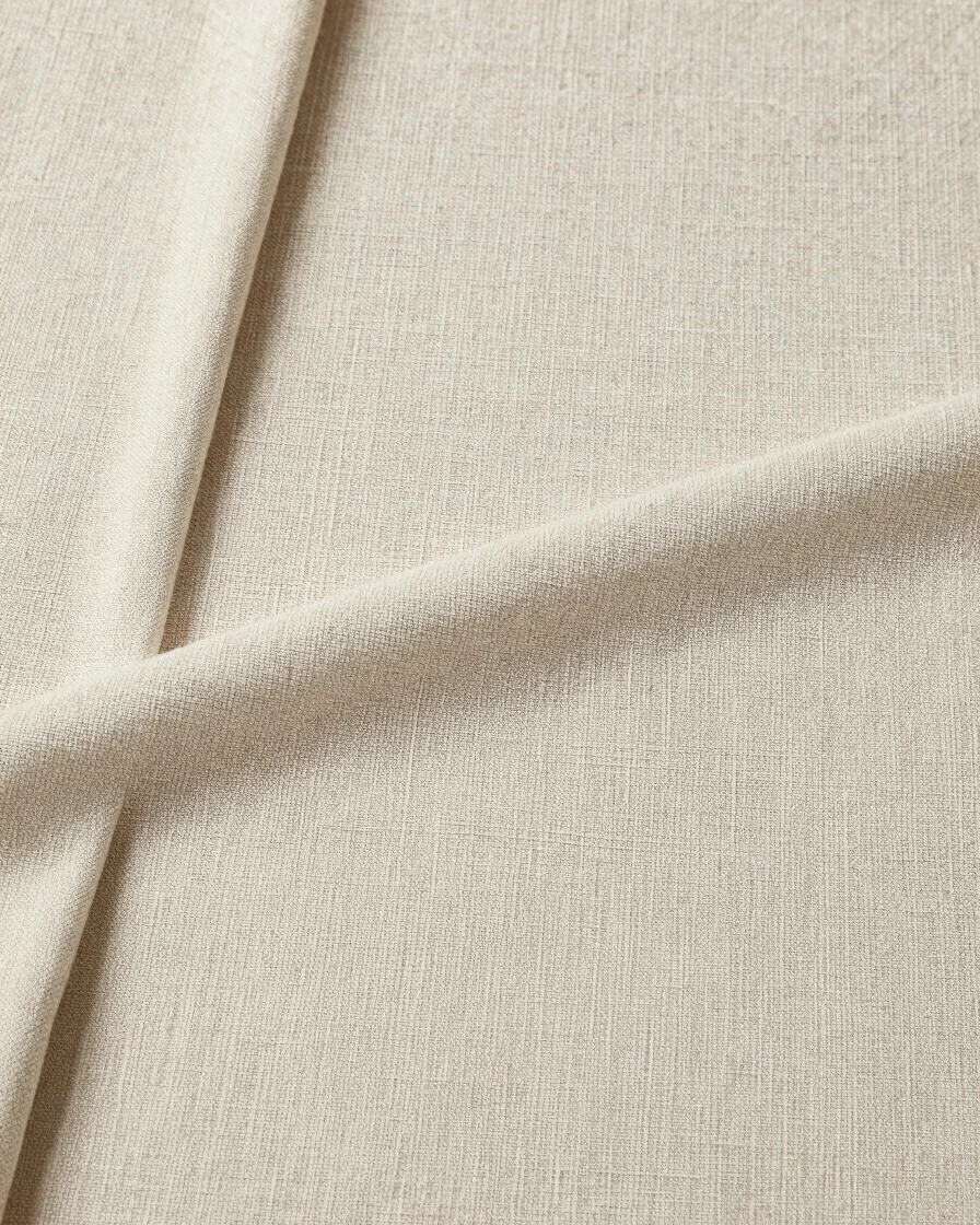 Editorial textile photography, overhead arrangement of woven cotton fabric with visible weave structure and tactile deta